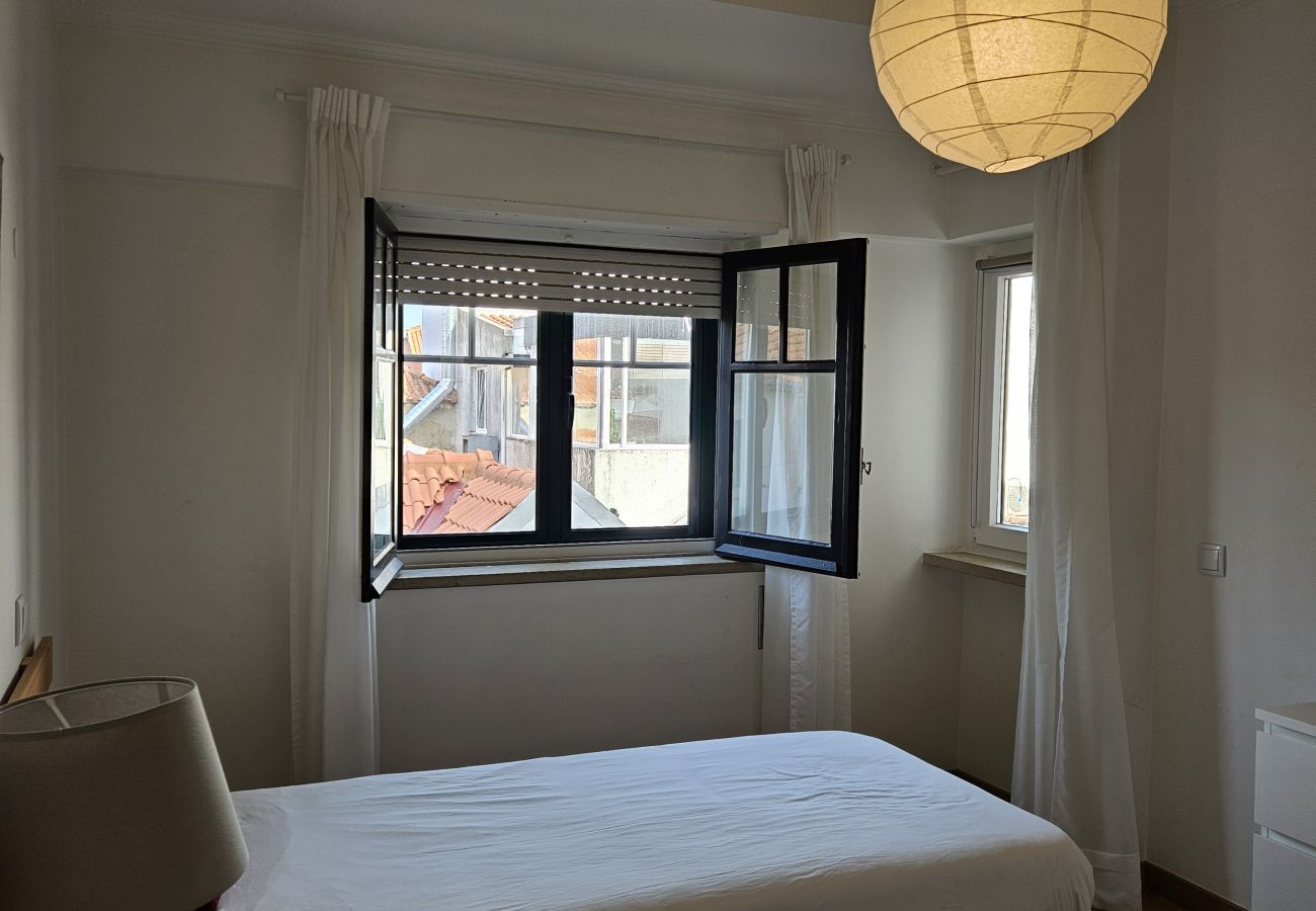 Comfortable room with two single beds and neutral colours. 
