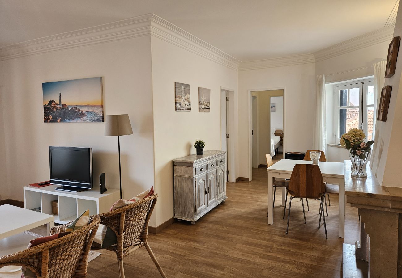 Living room with comfortable sofa, dining table and modern décor. 