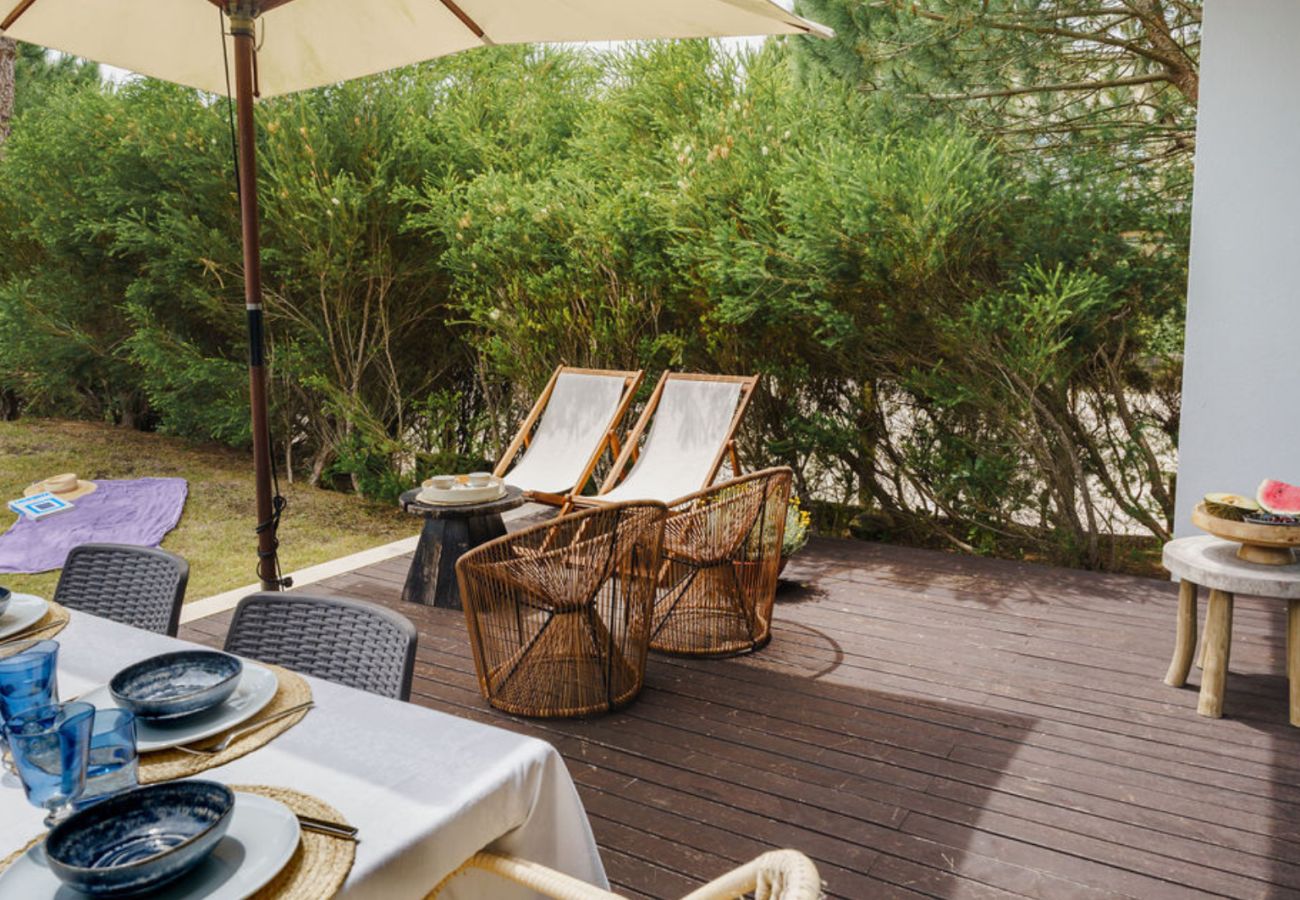 Comfortable loungers in the private garden of Pool Beach & Golf Troia.