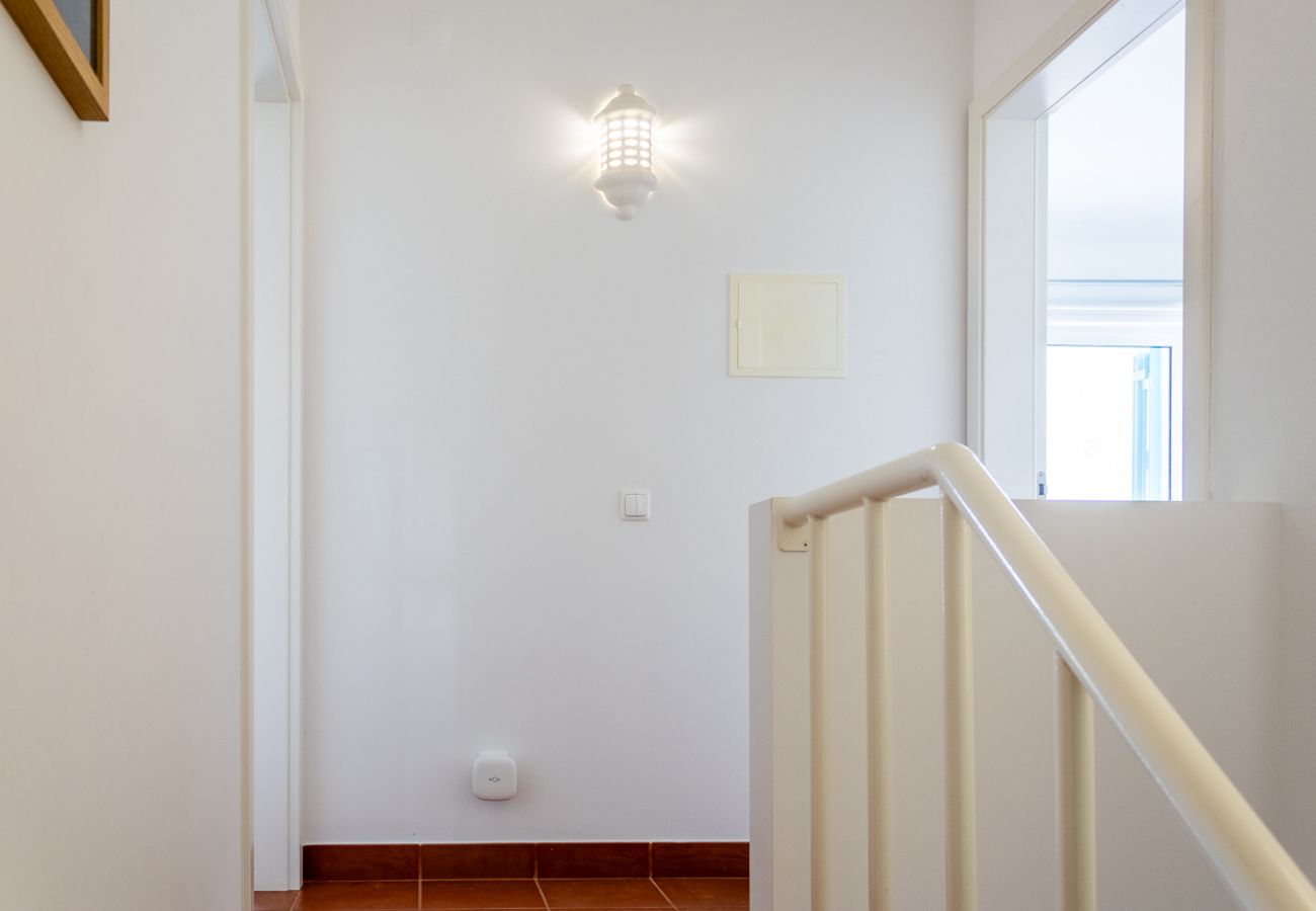 Bright hallway with staircase access