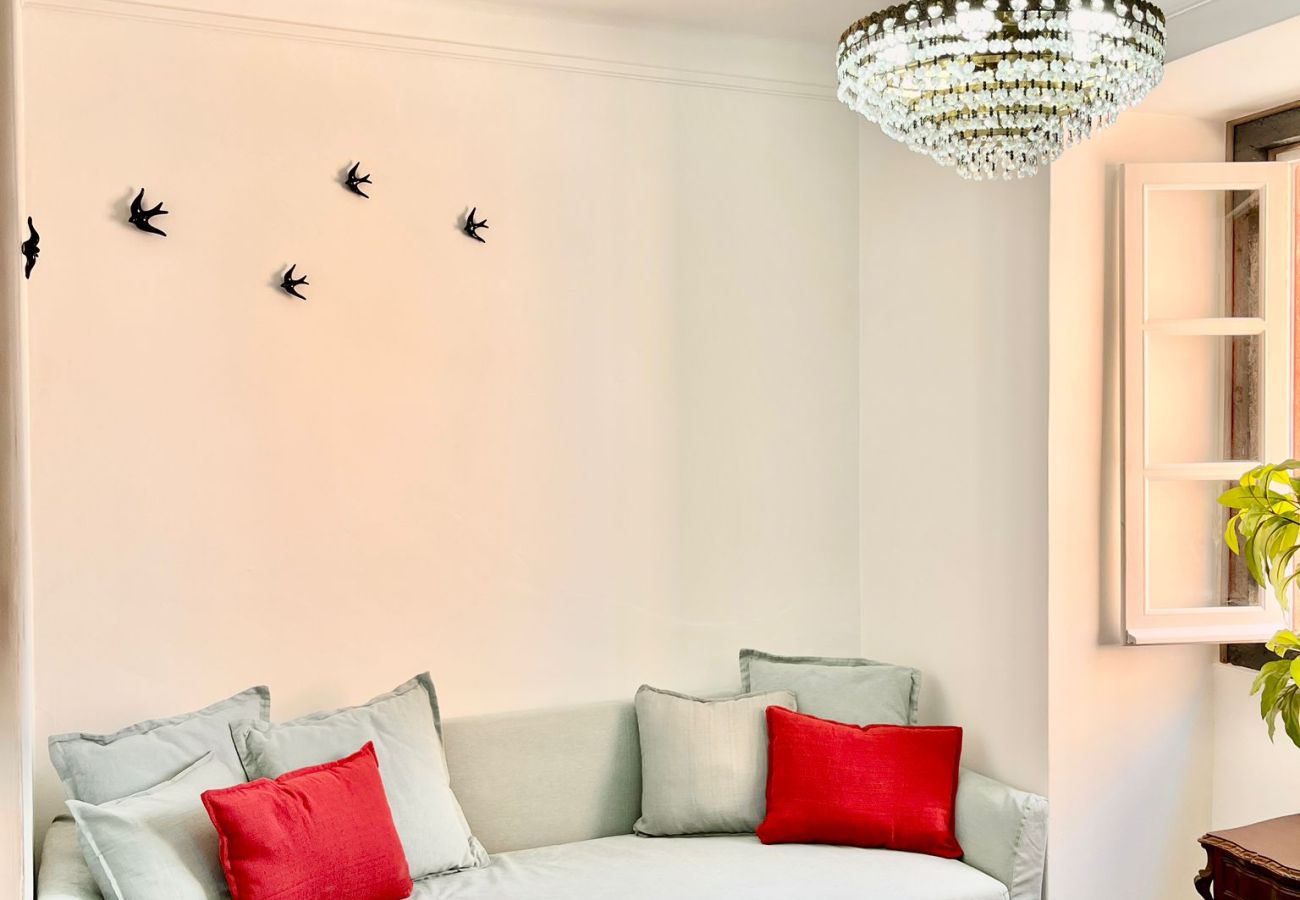 Comfortable bedroom featuring a double bed, soft pillows, and charming decor.